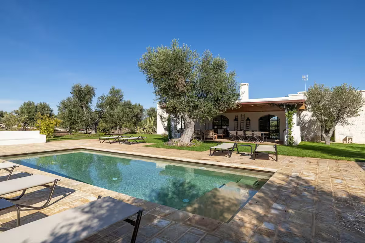 Villa pool with lounge chairs for relaxation